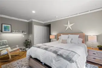 An additional lower-level bedroom serves perfectly as a guest room or a comfortable space for multi-generational living.