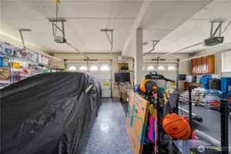 Large garage with surround sound system and speakers that convey. Custom flooring.