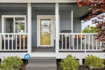 An inviting porch welcomes you in.