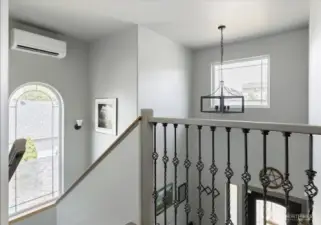 New railing, trim and a ductless mini-split! Loads of natural light fill the space.