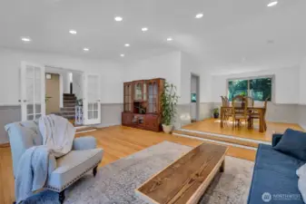 Large living room with beautiful hardwood floors and...