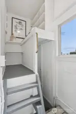 Cutest little pantry just off the kitchen is such a brilliant use of space! Stairs lead to the mostly finished basement