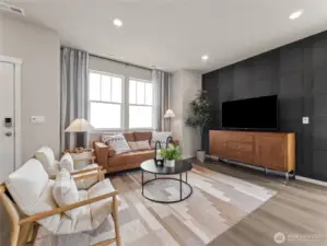 Light-filled great room showcases designer accent wall, recessed lighting and oversized windows for relaxed gatherings. Pictures are for representational purposes only, colors and features may vary.