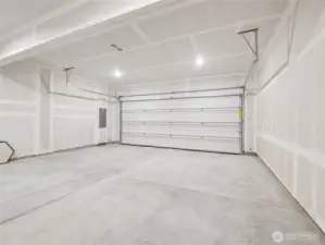 11: Spacious two-car alley-load garage is fully drywalled and brightly lit—ready for parking, storage, or workshop projects. Pictures are for representational purposes only, colors and features may vary.