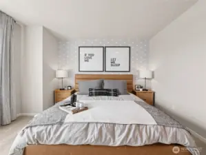 Close-up of owner’s retreat highlights geometric accent wallpaper, padded headboard and matching lamps for boutique-hotel style comfort. Pictures are for representational purposes only, colors and features may vary.