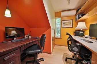 The office is colorful and functions beautifully for one or two people