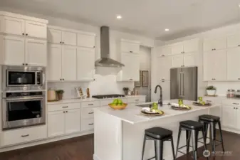Well-designed kitchen with center island overlooking the great room
