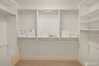 This walk-in closet completes the primary suite.