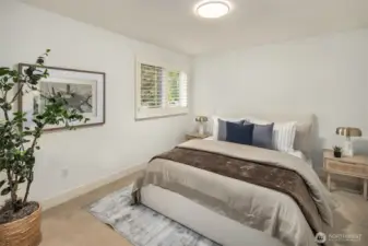 A second generously sized bedroom with a full bath completes the upper level.