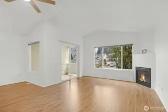 Expansive living room with gas fireplace and slider to a cover deck