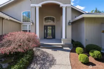 The elegant, high ceiling entry portico is the perfect spot to decorate for the holidays.