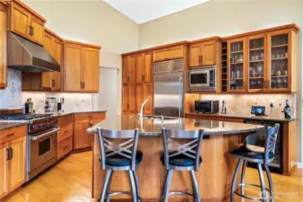 The kitchen is a chef's dream with beautiful finishes and high end appliances.
