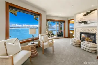 Primary suite also includes a gas fireplace which is great for sitting and relaxing on those cool mornings.  Large slider to upper deck.  Spacious and well lit space.