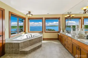 The primary bathroom doesn't lack any view,  With these three windows you see it all.  Perched above Puget Sound, most say these are better views than waterfront properties.