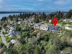 Nestled on the top of Three Tree Point on a private lane with views to Mt. Rainier and west to Vashon Island.