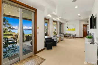 Slider off the family room to the covered patio with views as well.  This space is such a great flex space, could be used for family room, reading and relaxing space, excellent for a playroom and even a piano space! Some storage on this lower level here too.