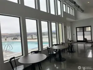 Window from the ceiling to the floor looking out to the pool and patio