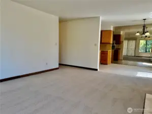 Living room right off the dining room with brand new carpet and fresh paint!