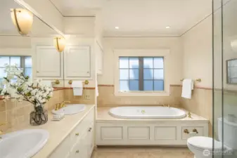 Ensuite bath has heated floors, vanity with double sinks, soaking tub and separate shower.