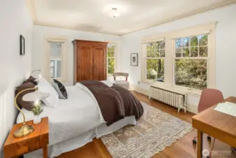 Southwest bedroom overlooks lush backyard.