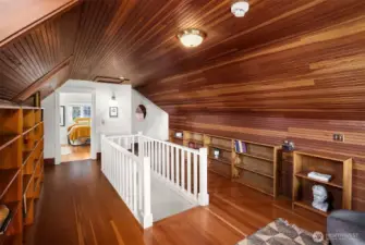Third level has bookshelves and reading area.
