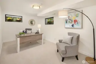 5th bedroom staged as an office has 3 nice windows lightening up the spaces beautifully.