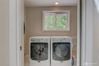 Upstairs full laundry room with plenty of working space