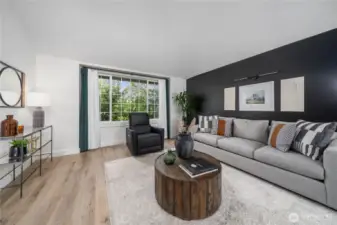 Upon stepping into this stunning home, the living area greats you with large windows funnel in tons of natural light!