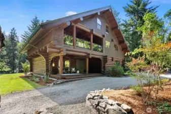 Large covered porches on the first and second floor to take in the serene landscaping & natural beauty