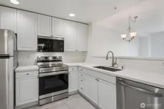 updated kitchen with new countertops, sink/faucet and new appliances