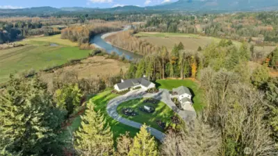 Exquisite French Country-inspired estate encompasses two distinct homes on 18.5 acres with spectacular territorial mountain and river views!