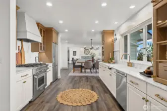 Amazing chef's kitchen, perfect for entertaining family and friends. Custom sideboard by entry (stays with home) was designed to be multifunctional and can be used as a moveable island, if desired.