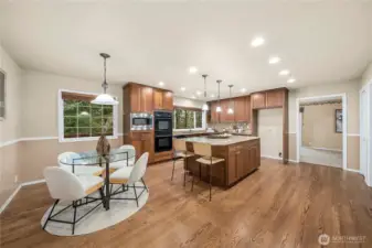 Enter from the garage into the kitchen and breakfast nook. Laundry room is directly off this room and easy access as a mudroom.