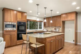 Fully updated kitchen with custom cabinetry and granite countertops.