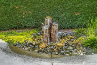 Basalt fountain on the West side of house.