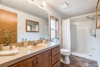 The spacious primary bathroom offers lots of counter space.