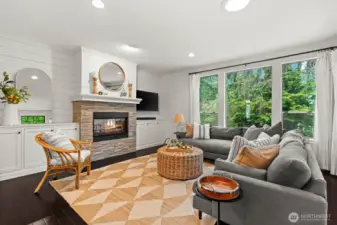 double sided fireplace. Windows overlooking private backyard
