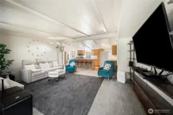 Living room with open layout connecting to the kitchen.