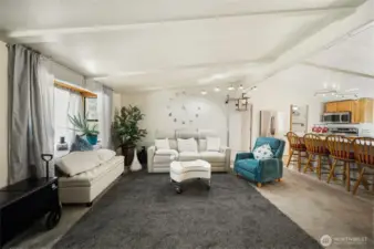 Another view of the living room and kitchen showing the open space, great for entertaining.