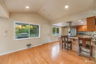 Great room features vaulted ceiling - perfect spot for a dining table!