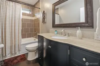 Bathroom is downstairs is located between the two bedrooms.