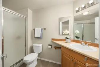 En-suite bathroom off of primary bedroom with walk-in shower.