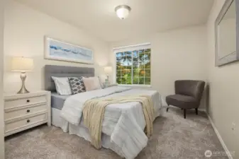 French doors to this bedroom offer versatile use as a bedroom, office or flexspace with ample natural light