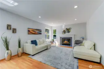 The cozy family room, featuring a gas fire place