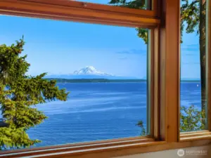 Triple-pane Loewen windows frame mountain and water views.