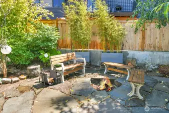 Enjoy the firepit and side yard with bamboo privacy fence