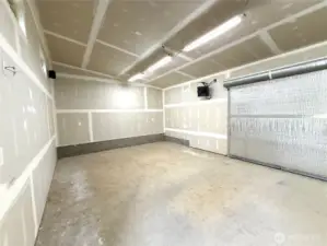 Interior view with roll-up door leading to alley.