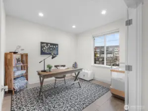 Office/Den with french doors grace the front entry.
