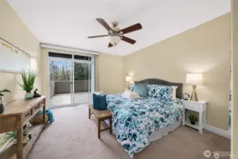 Primary suite featuring an en-suite bathroom, walk in closet and a private balcony