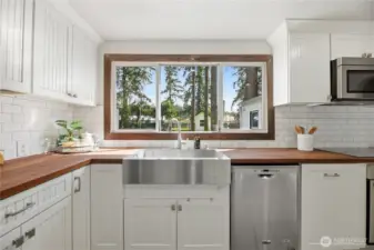 Kitchen looks out to the HUGE, park-like backyard